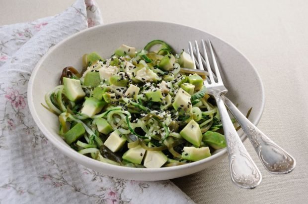 Avocado salad, sea cabbage and cucumbers