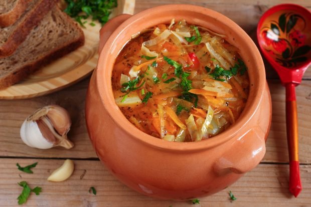 Cabbage soup, tomatoes and pepper for the winter in banks