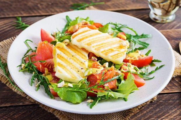 Festive salad with red fish and fried cheese Halumi