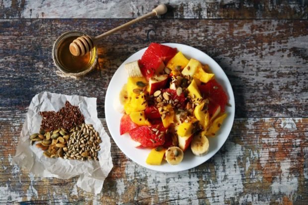 Grapefruit, mango, banana and apples fruit salad