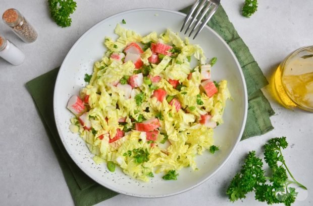 Peking cabbage salad, crab sticks and green onions