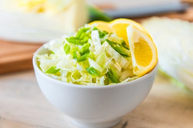 Peking cabbage salad, green onions and lemon