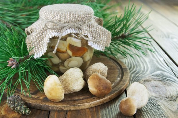 Pickled white mushrooms in banks for the winter