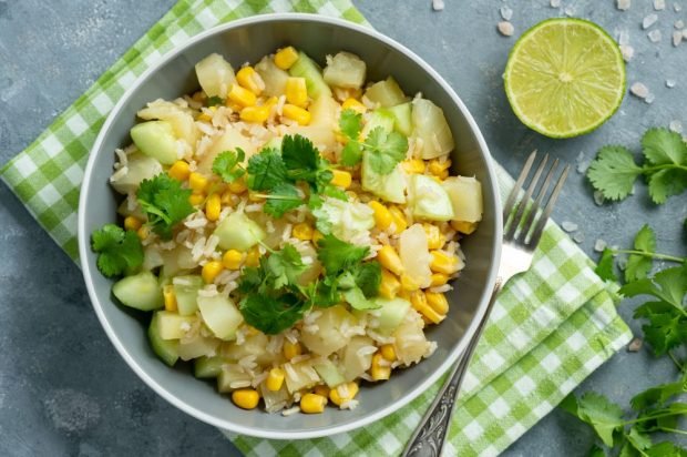 Salad with pineapple, cucumbers, rice and corn