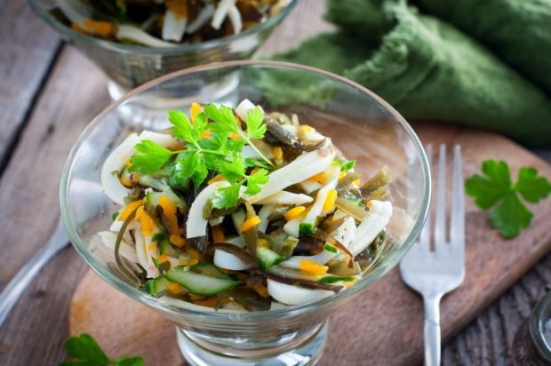 Salad with squid, sea cabbage, carrots and cucumbers