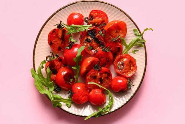 Tomatoes on the barbecue on the grille